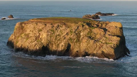 Rising Aerial View of Table Rock Sea Stack in Bandon, Oregon Stock Footage 299730680
