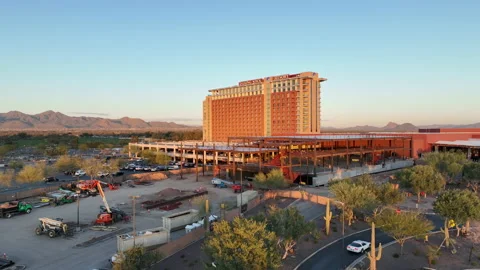 Rising aerial view of the Talking Stick Resort building at sunset in Vídeo Stock 233672763