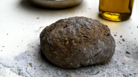 Rising of black bread after kneading it Stock-Footage 106140083