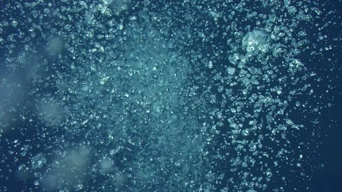 Rising bubbles with light reflections un... | Stock Video | Pond5