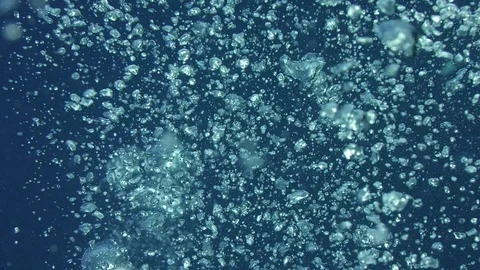 Rising bubbles with light reflections underwater, Indonesia Stock Footage 84927546