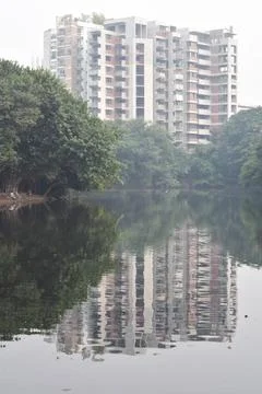 Rising building apartments and fabulous shadow on the water in Dhanmondi Lake Stock Photos