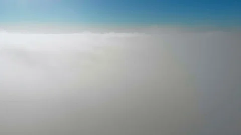 Rising up from clouds in 4K Stock Footage 100701636