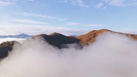Rising From The Clouds For A Magical View Of The Hills In The Morning Sun Stock Footage 320310951