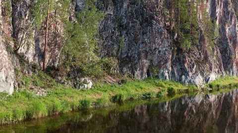 Rising the copter up along steep cliffs. 스톡 동영상 116605632