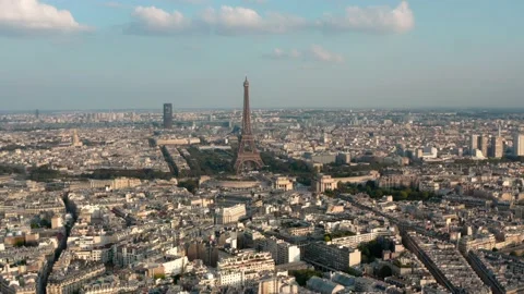 Rising dolly forward drone shot towards the Eiffel Tower Paris at sunset Video stock 162465509