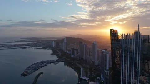 Rising Drone Aerial View of Panama City Waterfront and Skyline at Sunset Видео 339911543