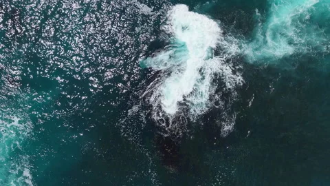 Rising Drone with Counter Clockwise Rotation Over Waves Crashing on Rock Stock Footage 330318097