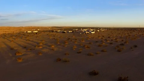Rising drone shot of big RV camp in the desert Stock Footage 99158477