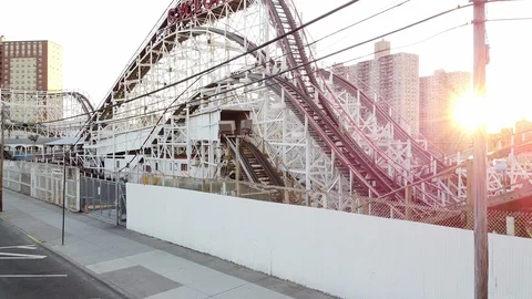 Rising drone shot of Cyclone Roller Coaster COney Island sunrise Stock Footage 129759510