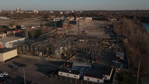 Rising drone shot of electrical substation with parking lot in foreground and Stock-Footage 333525407