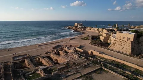 Rising drone shot over Caesarea National Park in Israel, revealing ancient Stock Footage 322763138