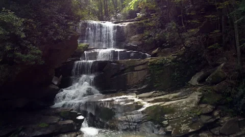Rising drone shot of a waterfall in the forest Stock Footage 218611451