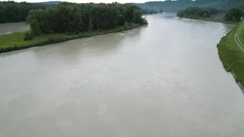 Rising drone video in 4k of high water Inn river with island Stock Footage 249266371