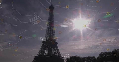 Rising Eiffel Tower silhouette casting lens flare at Champ de Mars, digital H Foto stock