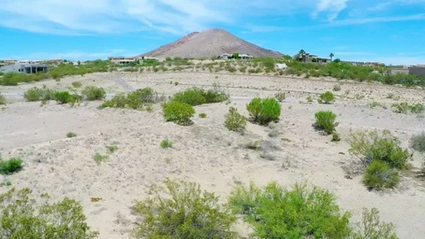 Rising Fly Over Towards Desert Neighborhood Big Mountain Stock Footage 76003761