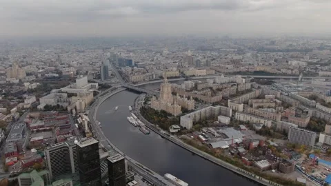 Rising forward drone shot over sweeping riverfront skyline, Dlog footage Stock Footage 322185941