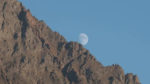Rising of the Full Moon Before Sunset in the Mountains Stock Footage 106289902
