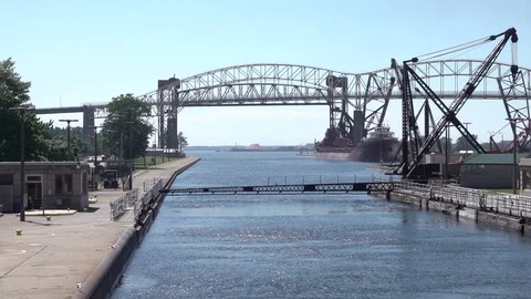 Rising gate signals safe exit through Soo Locks on the St. Mary's River Stock Footage 123086132