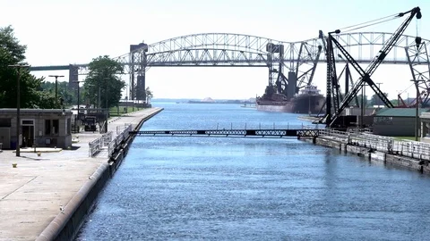 Rising gate signals safe exit through Soo Locks on the St. Mary's River Stock Footage 124165929