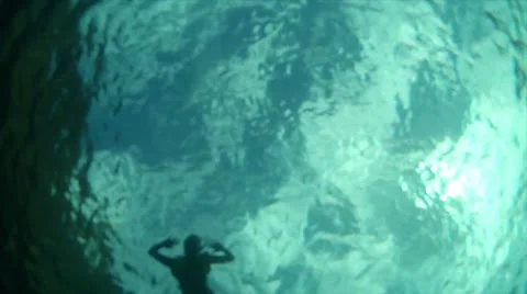 Rising to meet swimmer Stock Footage 24339387