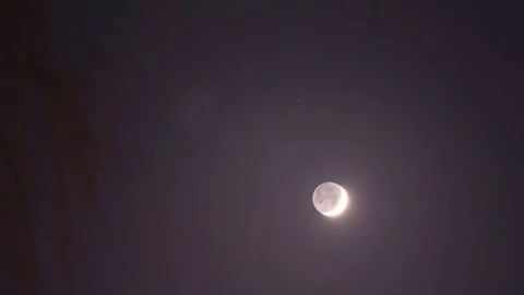 The rising moon in the night sky. 4k video with the earth's natural satellite Stock Footage 284443133