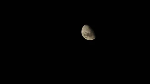 Rising moon with sunlight reflected on the dark night sky Stock Footage 181755239