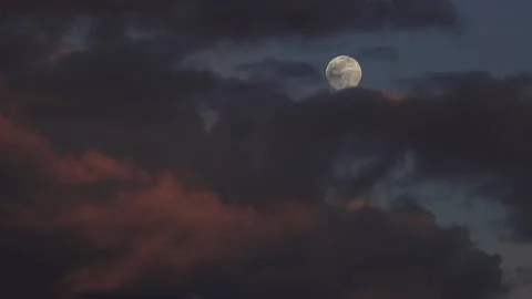 Rising Moon through Clouds Time Lapse Stock Footage 140831423