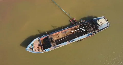 Rising up from an operation of pumping sand out of a dredging boat through pipe Stock Footage 101930612