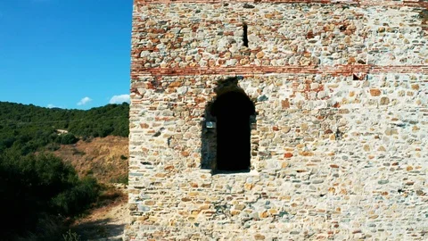 Rising over ancient stone tower. Close up take of shot. Video stock 118187898