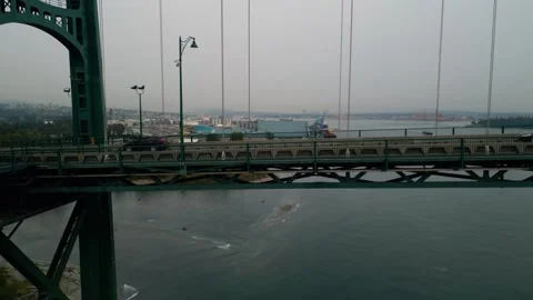 Rising up over Lions Gate bridge deck at dusk 動画素材 248483541
