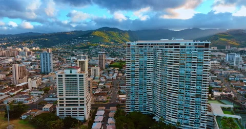 Rising over the multi-storied residential building in the cityscape of Honolulu. Stock Footage 306887245