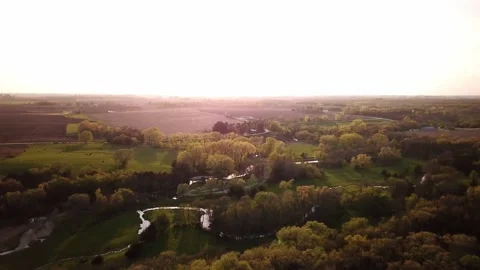 Rising over a small river at sunset Stock Footage 138321980