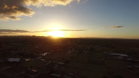 Rising over Town at Sunset Stock Footage