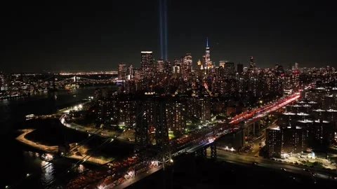 Rising Over Williamsburg Bridge Toward 9/11 Tribute in Light and One WTC Stock Footage 345293229