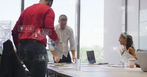 Rising project team preparing at conference table, man in red distributing Vídeo Stock 332296344