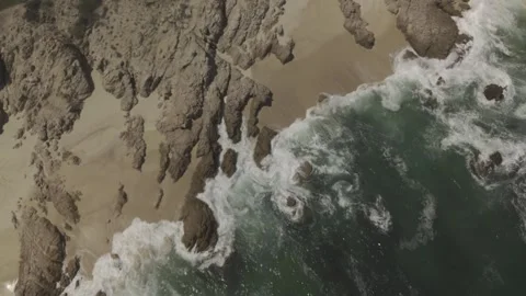 Rising from the rocks on the beach Stock Footage 279775278