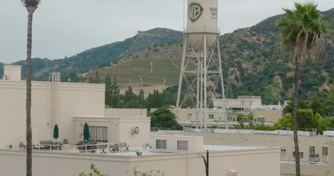 Rising shot of Aerial pull-back shot of Warner Brothers WB Water Tower at Studio Stock-Footage 242862581