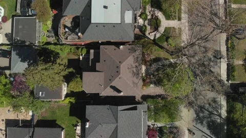 Rising shot over homes' rooftops. 스톡 동영상 165062213