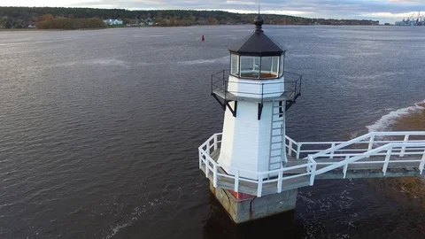 Rising Shot of a Riverside Lighthouse Video stock 97545495