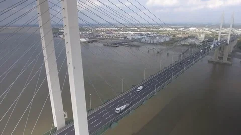 Rising Shot of Vehicles Using A Suspension Bridge Stock Footage 69256646