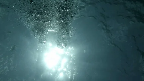 Rising silvery bubbles and distant SMB buoy on surface Stock Footage 91778339