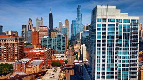 Rising slowly over the street with multi-lane highway. Skyscrapers of downtown Stock Footage 336670130