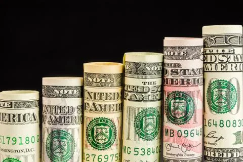 Rising steps made of rolls of all american dollar banknotes Stock Photos