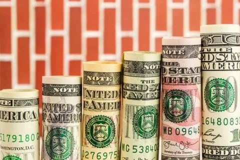 Rising steps made of rolls of all american dollar banknotes Foto stock