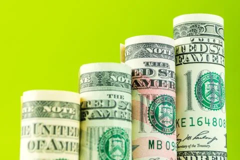 Rising steps made of rolls of four most valued american dollar banknotes Stock Photos