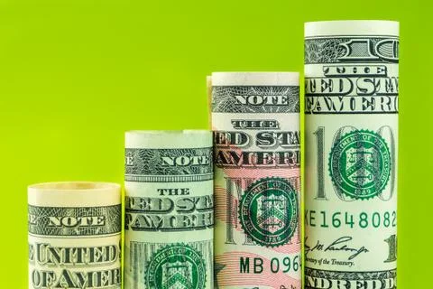 Rising steps made of rolls of four most valued american dollar banknotes Foto stock