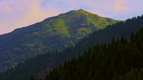 The rising sun on the Alps colors the clouds and the valleys red Stock Footage 161783399