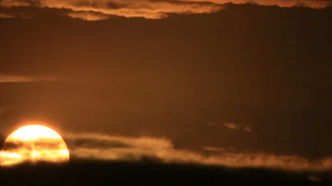 Rising sun appear from dark cloudscape Stock-Footage 161470418