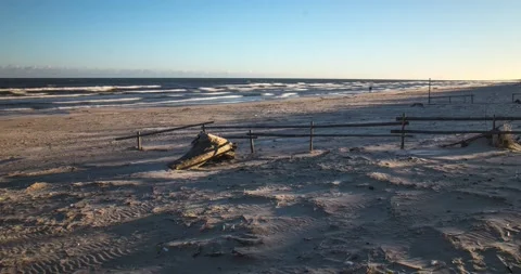 The rising sun on the beach, the floating Baltic sea in the background Stock Footage 152850864